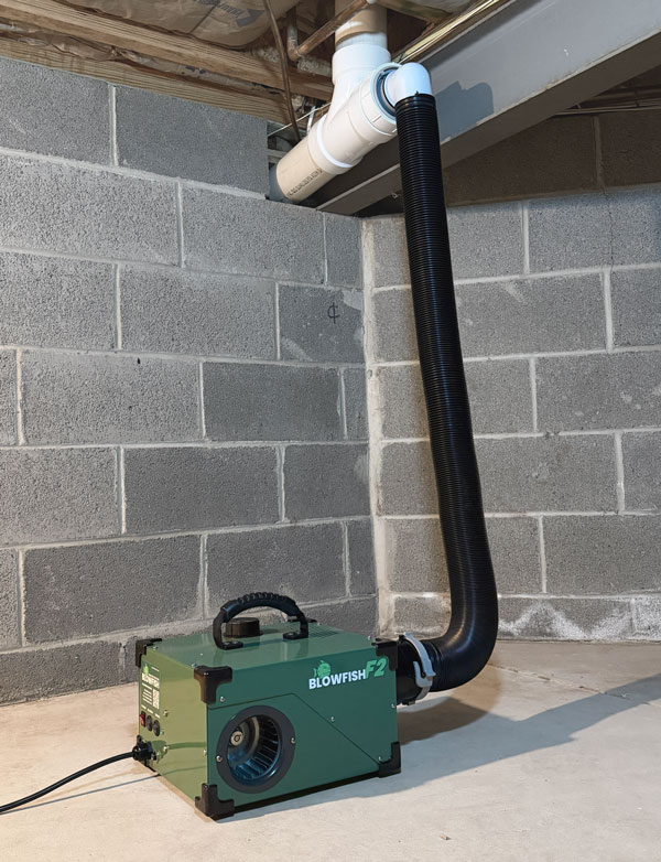 Blowfish F2 plumbing smoke blower connected to a sewer cleanout during a plumbing smoke test